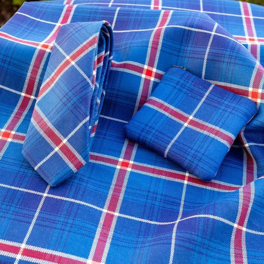 Tie and small bag made of Icelandic Tartan set on a Icelandic Tartan background