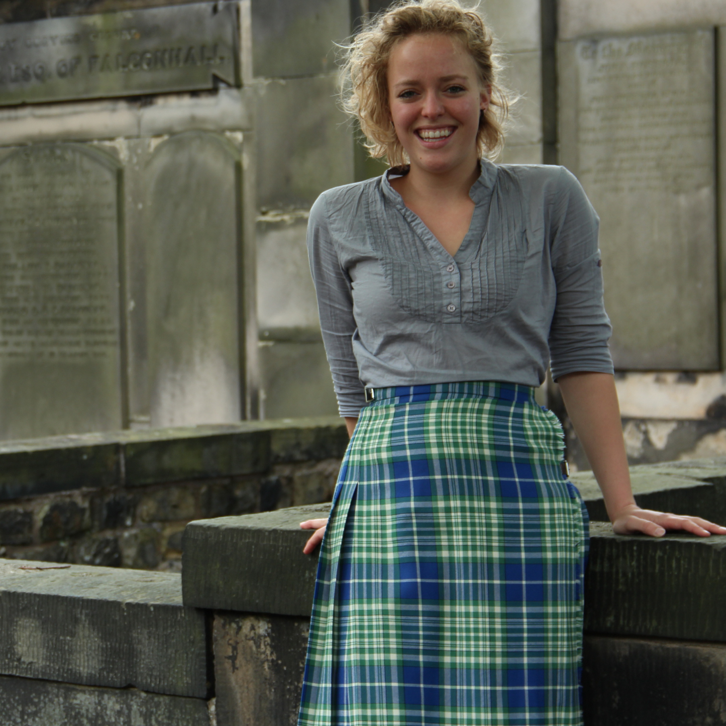 Woman in Nigeria tartan kilted skirt