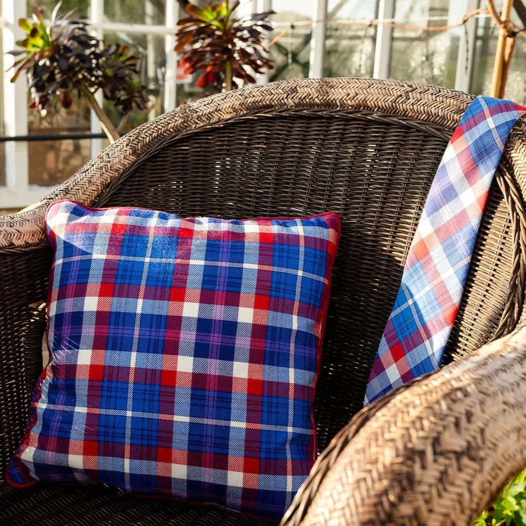 Auld Alliance tartan cushion and tie on a chair
