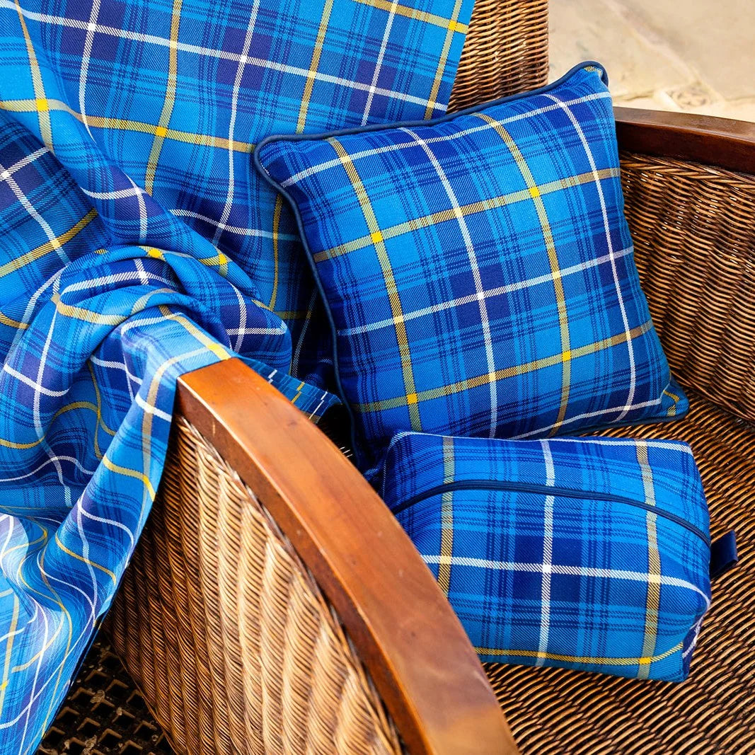 Swedish tartan cushion, box bag and shawl on chair