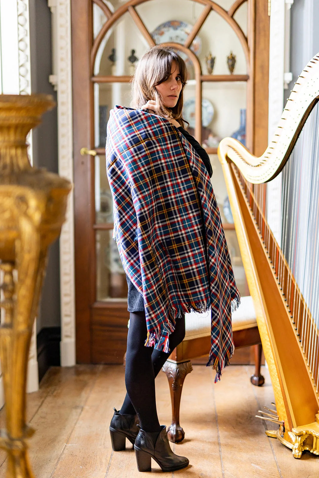 handmade tartan shawl draped over shoulders in soft wool