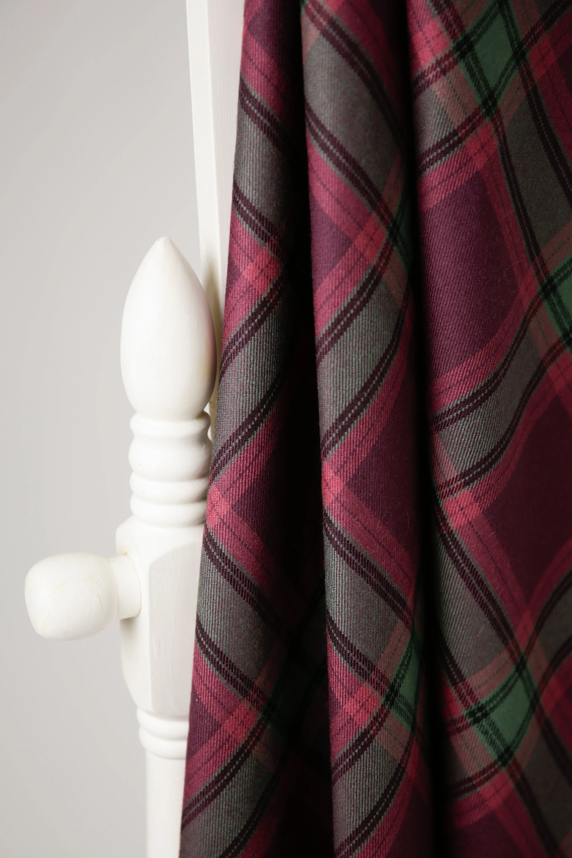 handmade tartan shawl draped over a chair in 100% wool 