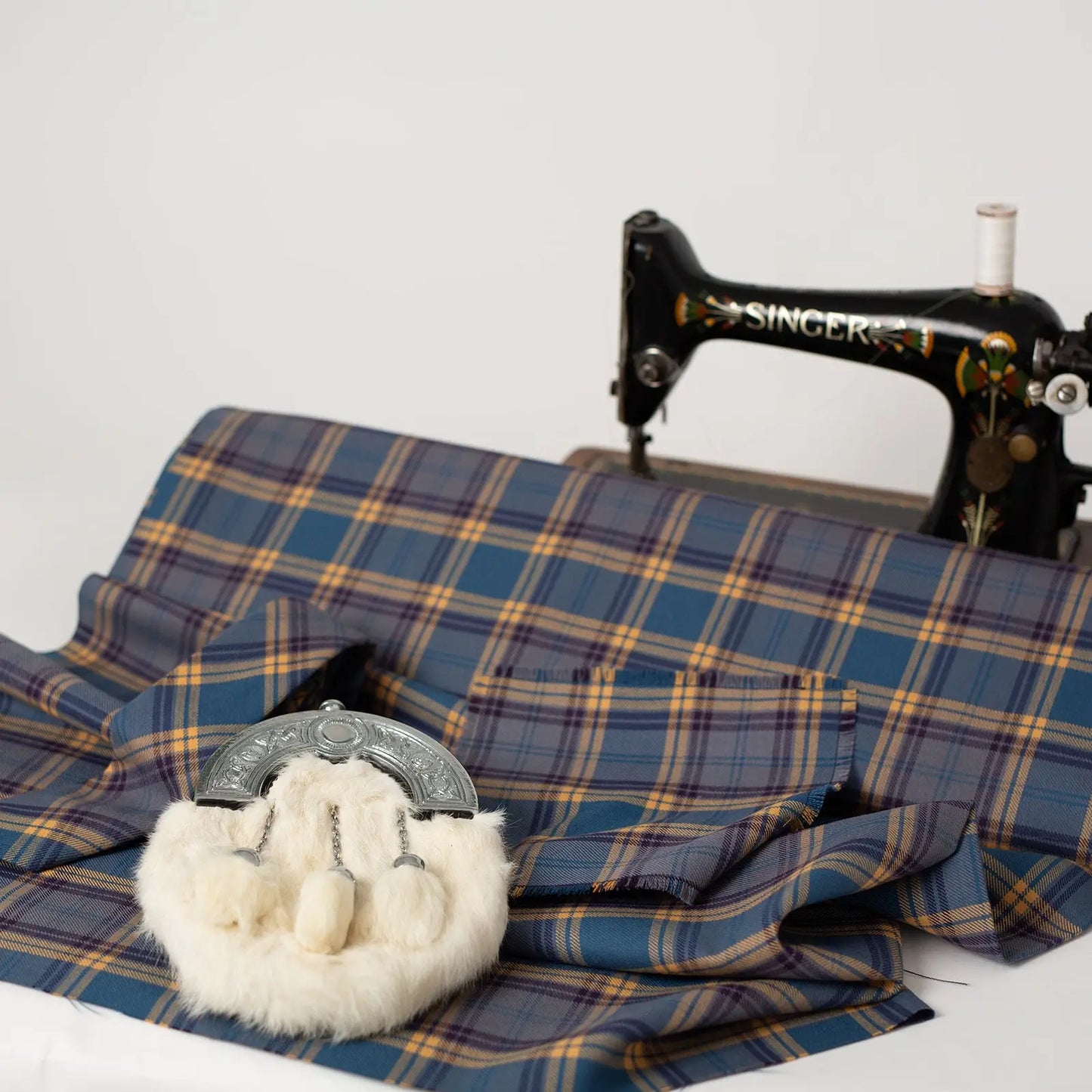 Dunn tartan with vintage sewing machine and sporran
